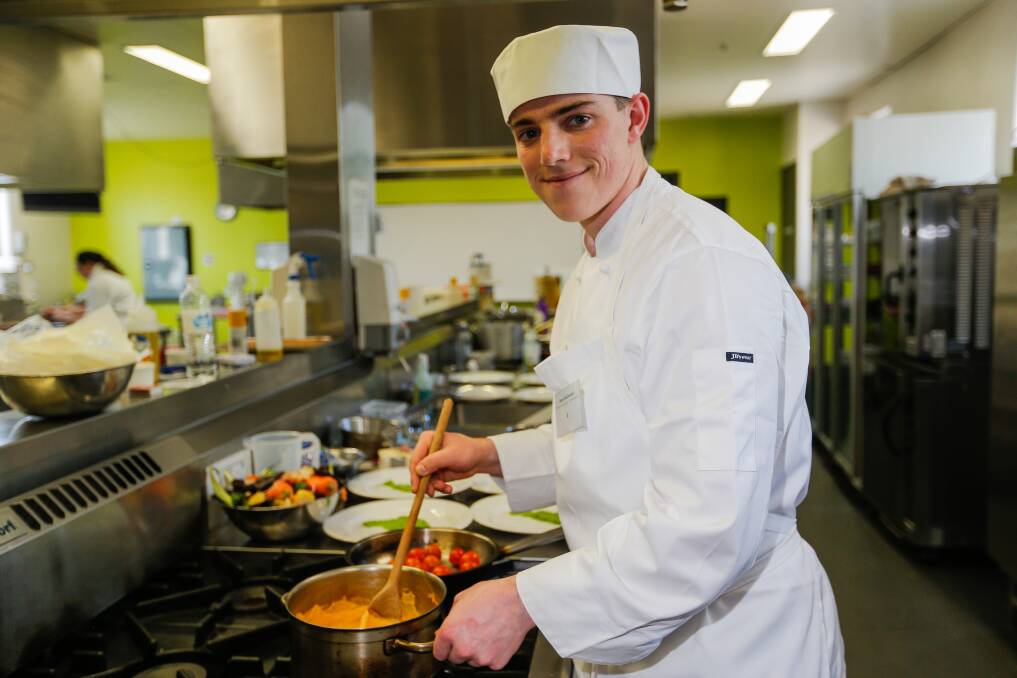 IMPRESSING JUDGES: Bryce McDonald cooking a main course at the WorldSkills event for apprentice chefs at Warrnambool's South West TAFE. Picture: Anthony Brady