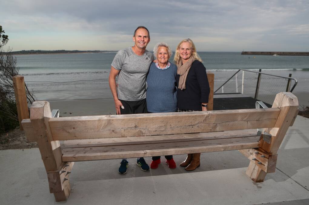 TRIBUTE: Mary Jackson with her son Iain Jackson and daughter Cathy Barling at the seat that will be a constant reminder of her beloved husband Joe. Picture: Morgan Hancock