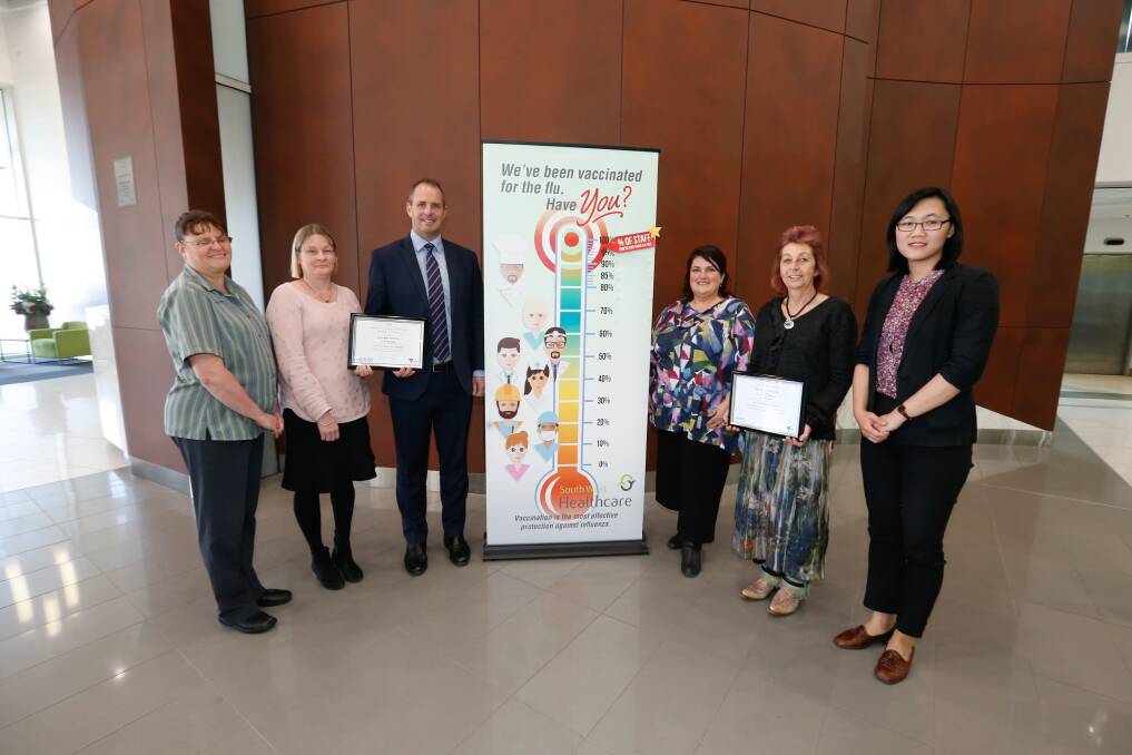 Award: Administrative support officer Jayne Slade, infection control nurse consultant Cynthia Gibbons, CEO Craig Fraser, infection control coordinator Jenny Lukeis, volunteer services coordinator Julie Evans and Dr Kay Li celebrate the hospital's achievement. Picture: Mark Witte
