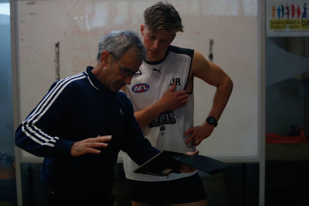 Learning: Jay Rantall listens to Dr Warren Young's advice. Picture: Mark Witte