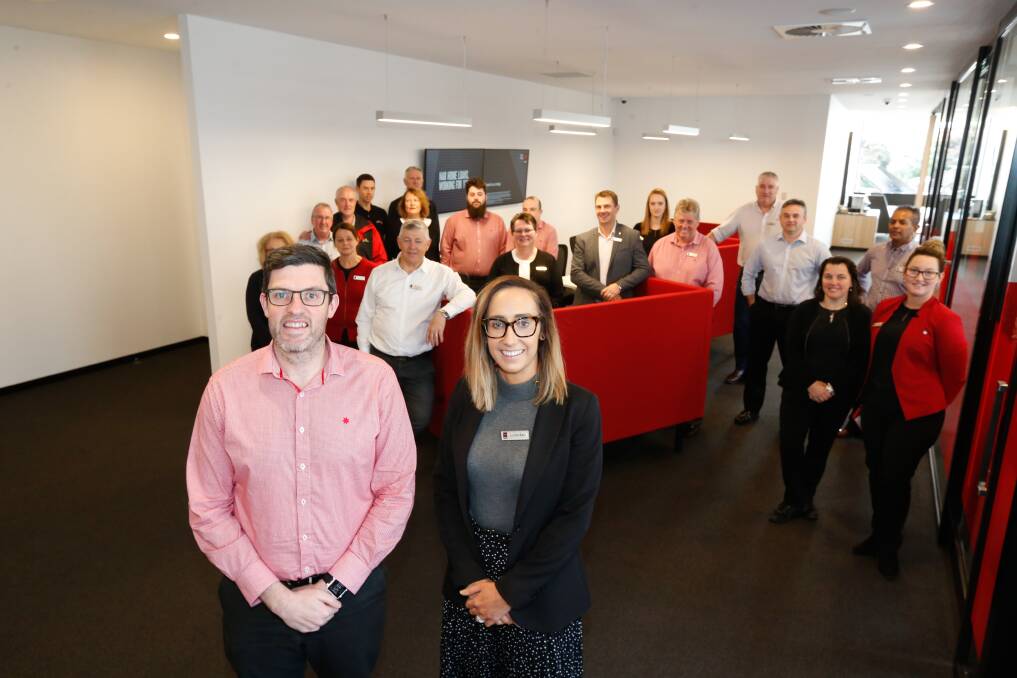 OPEN FOR BANKING: NAB branch manager Scott Coverdale and manging partner for south-west Victoria Jaime Barr with their team in the new Koroit street branch. Picture: Mark Witte