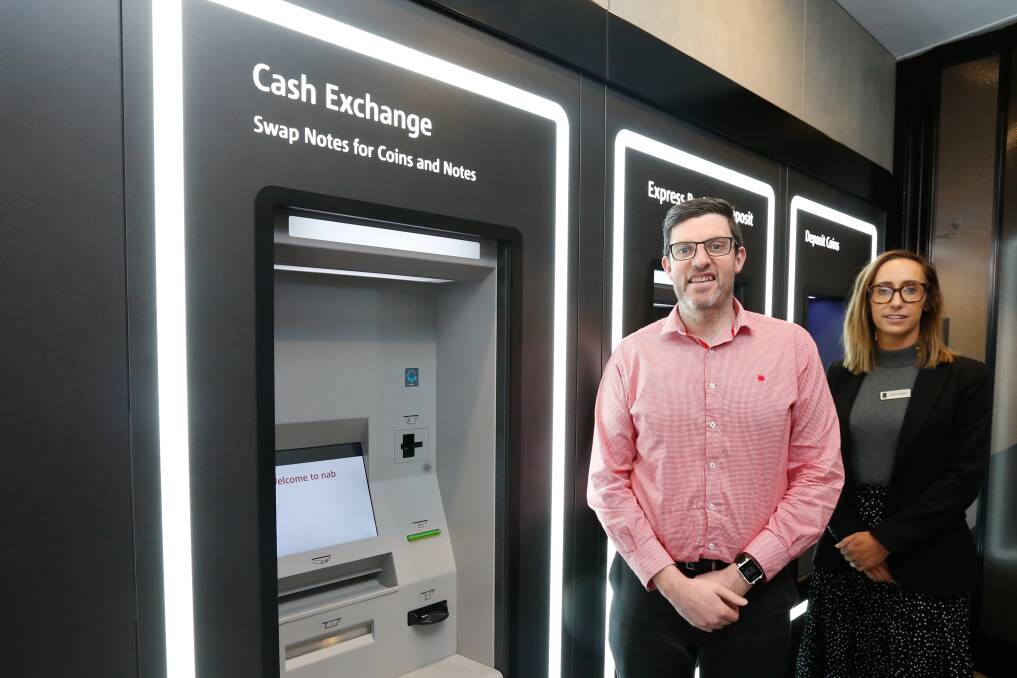 NEW-LOOK BANK: Branch Manager Scott Coverdale and managing partner for south-west Victoria Jaime Barr infront off the new ATM's in which will be open 24 hours a day. Picture: Mark Witte
