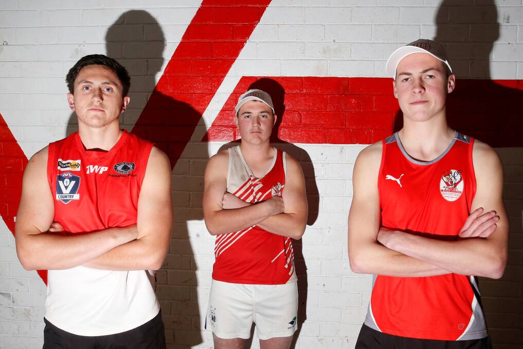 RED AND WHITE THROUGH AND THROUGH: South Warrnambool's Luke Byrne, Josh Folkes and Jaidyn Hawkins prepare for the Hampden league under 18 grand final on Saturday. Picture: Mark Witte