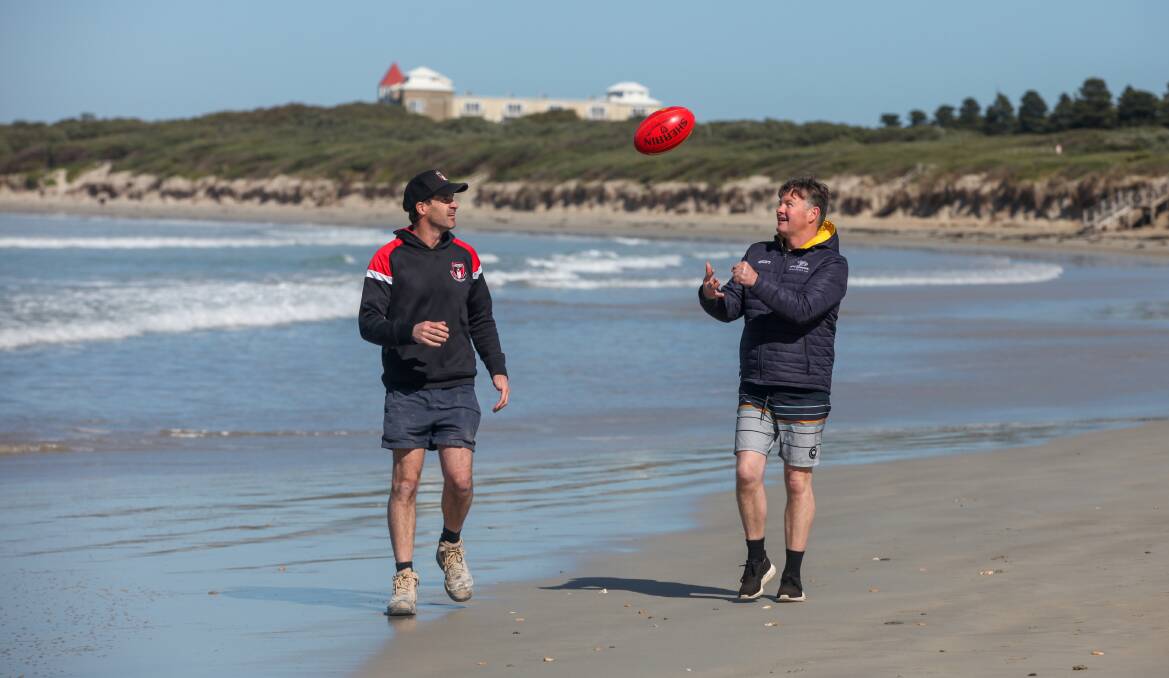 STILL MATES: Koroit coach Chris McLaren and North Warrnambool Eagles coach Adam Dowie have a quiet moment along the beach in the lead up to the grand final. Picture: Rob Gunstone