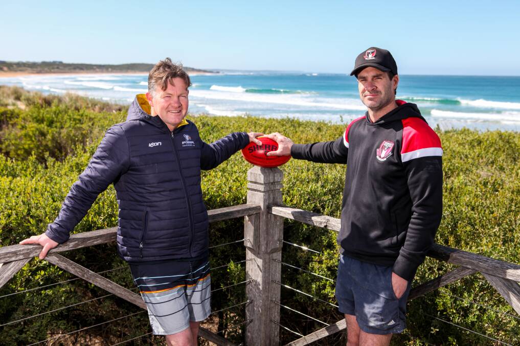 Frenemies: North Warrnambool Eagles coach Adam Dowie and Koroit counterpart Chris McLaren enjoy a friendly catch up before their teams lock horns in the grand final. Picture: Rob Gunstone