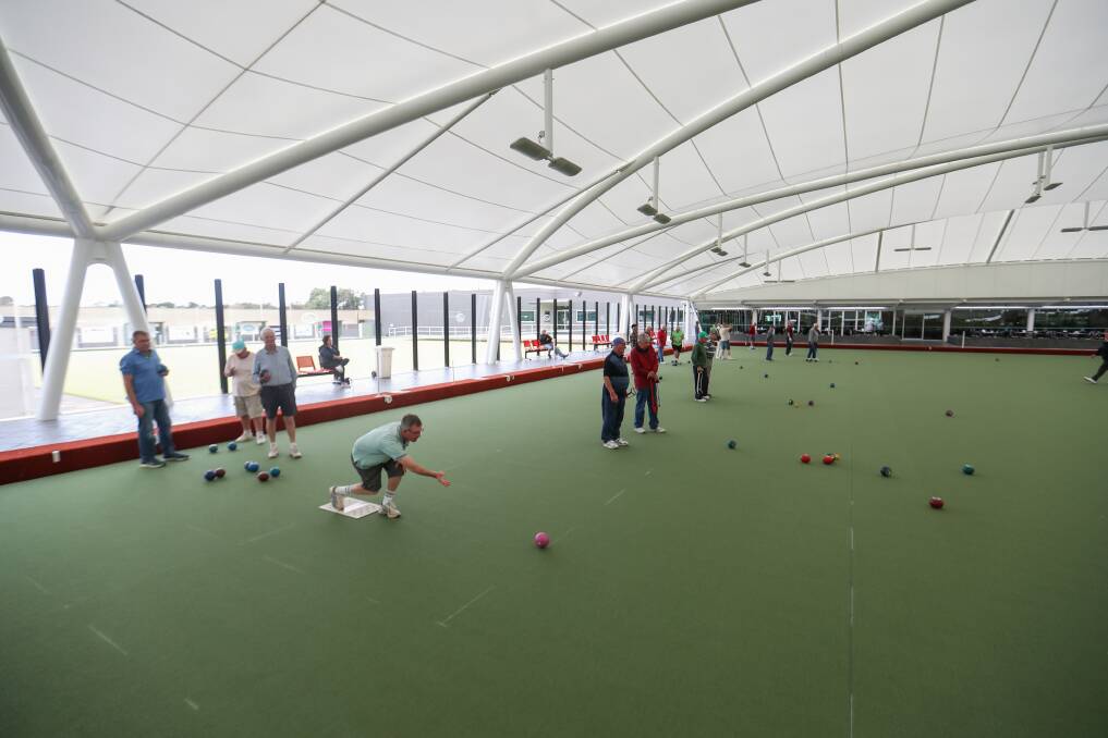 TESTING THE GREEN: Bowlers at the new undercover bowls arena. Picture: Morgan Hancock