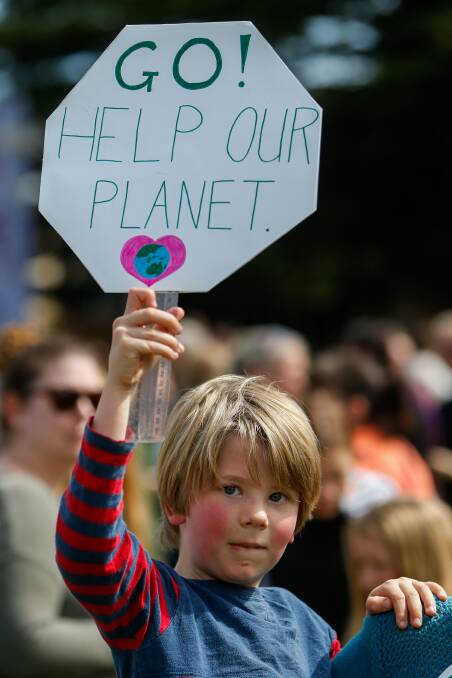 Johnnie Reeve, 5, holds his sign up high at the climate strike in Warrnambool. Picture: Morgan Hancock