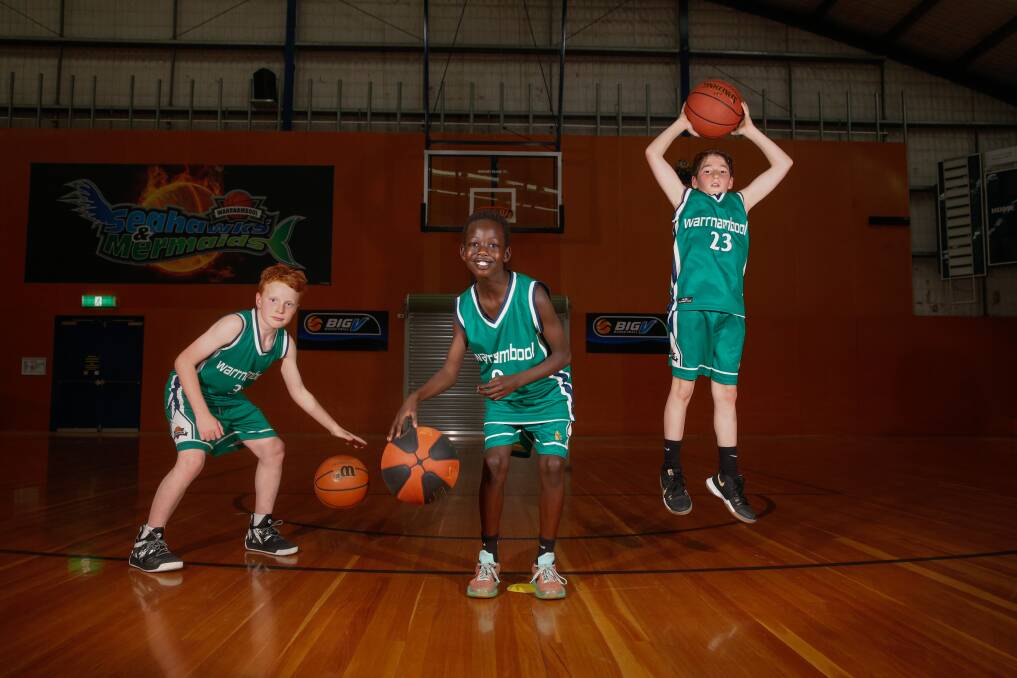 Time to play ball: (l-r) Jimmy Stevens, 9, Mali Lual,10 and Ethan Debono, 10 ahead of the 3x3 Street Hustle tournament to be held in Warrnambool on September 29. Picture: Mark Witte