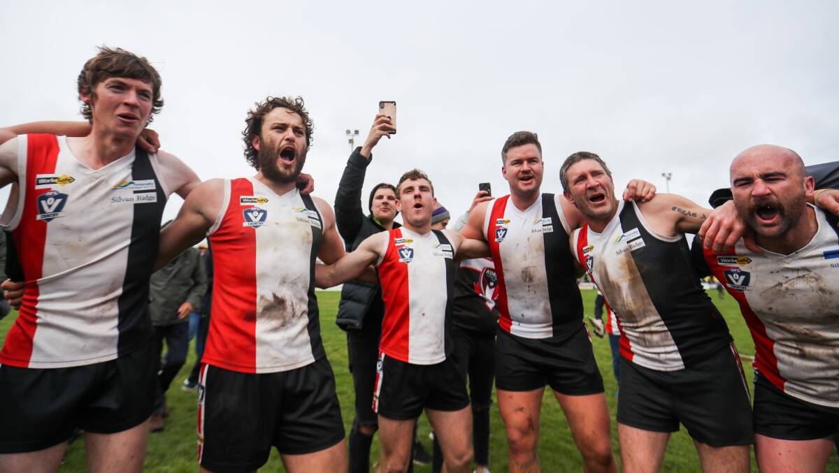 THE TEAM WE LOVE SO DEAR: Koroit players sing the song after claiming their premiership. Picture: Morgan Hancock