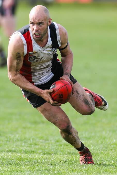 READY TO GO: Koroit's Damian O'Connor runs with the ball during Saturday's grand final. Picture: Morgan Hancock