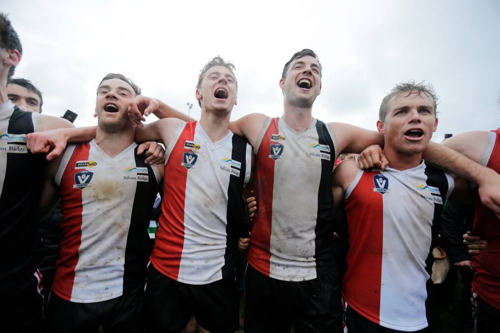 PREMIERS: Koroit's James North, Connor Hinkley, Jeremy Hausler and Tom Couch sings the team song after winning the grand final. Picture: Mark Witte