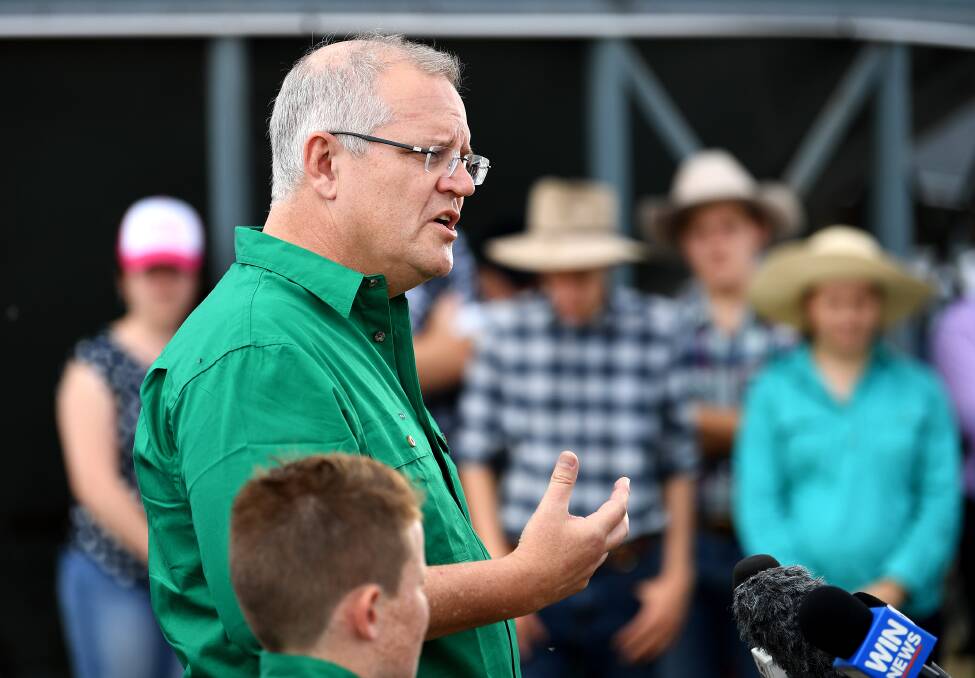 Australian Prime Minister Scott Morrison speaks to the media during a visit to a drought-affected property near Dalby, in Queensland, on Friday. Mr Morrison announced a new support package of nearly $100 million to drought-hit communities including $1 million to the Moyne shire which is enjoying a super winter/spring season.
