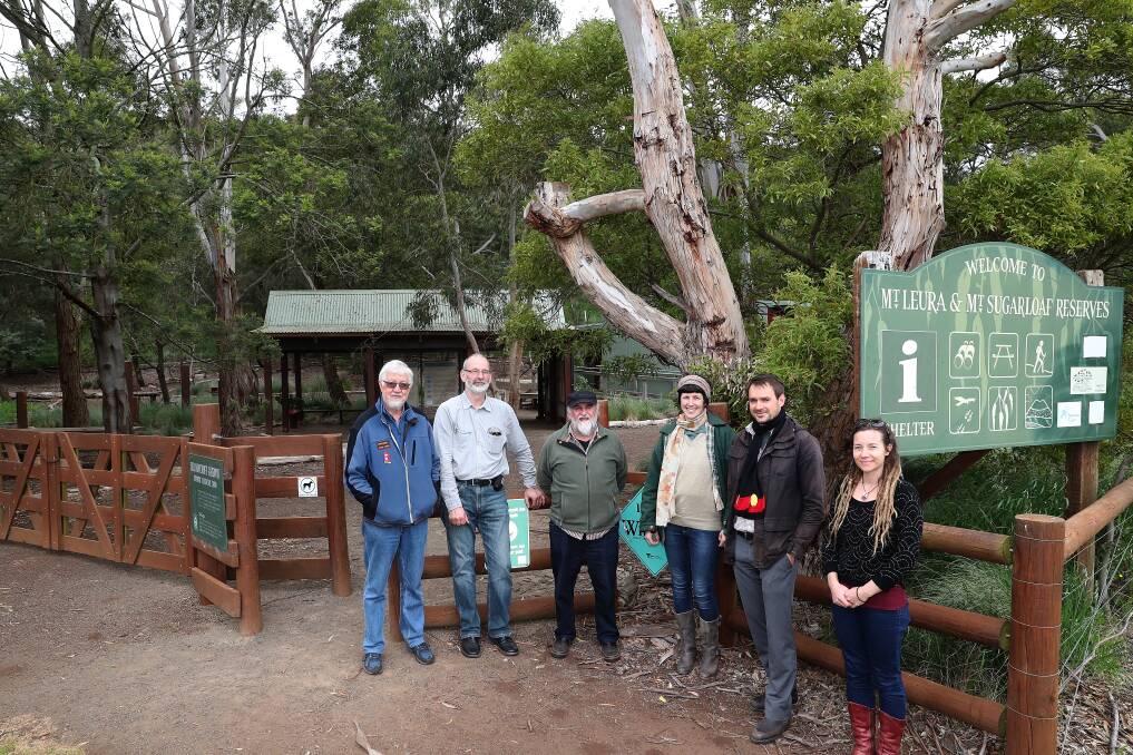 Conservation: Mount Leura committee members Graham Arkinstall, Garth Wesson, Greg Farmer, Becky McCann, Corangamite shire environment projects officer Rowland Herbert and Ammie Jackson outside the front of the Mount Leura and Mount Sugarloaf Reserve. Picture: Mark Witte