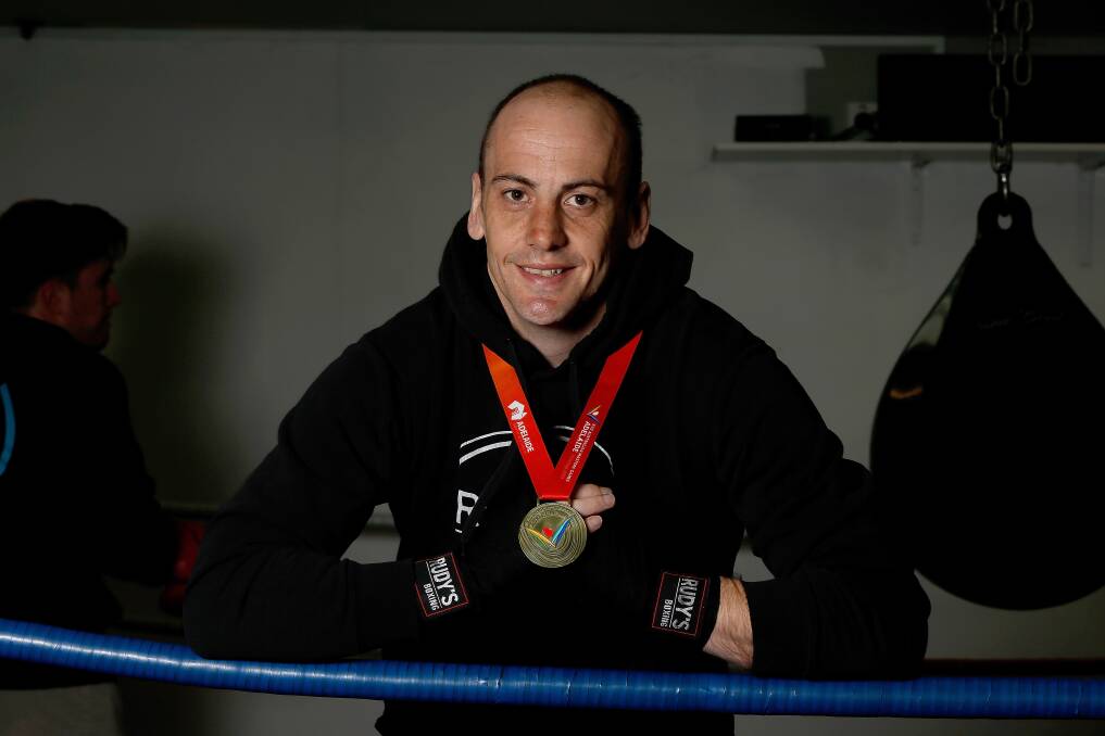 TO THE WINNER GOES THE SPOILS: Australian masters gold medallist Brad Rogers with his gold medal at Rudy's Gym in Warrnambool. Picture: Mark Witte