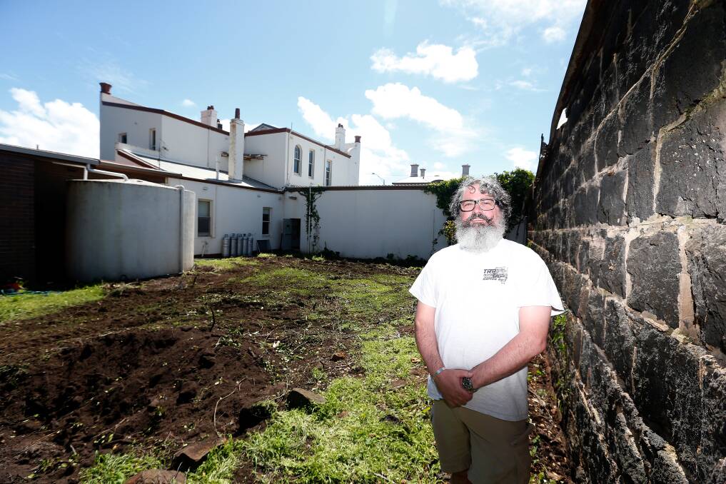VISION: New Port Fairy business owner Tim Sutherland in the garden of the former Port Fairy NAB building, which will have a pop-up bar and eatery this summer. Picture: Mark Witte