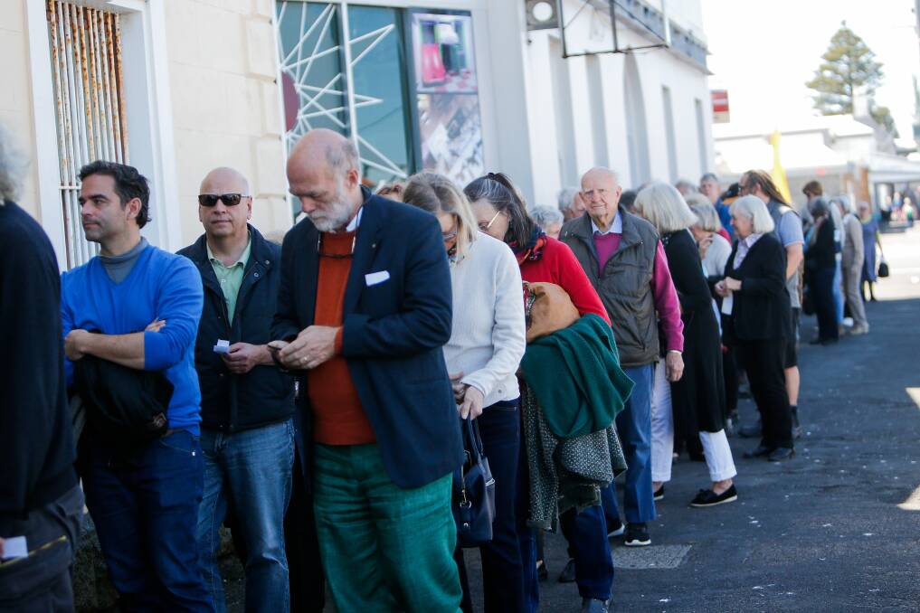 CHANGE: A big crowd lines up to get in the Drill Hall during the 2019 Port Fairy Spring Music Festival. The festival activity will be online this year. Picture: Anthony Brady