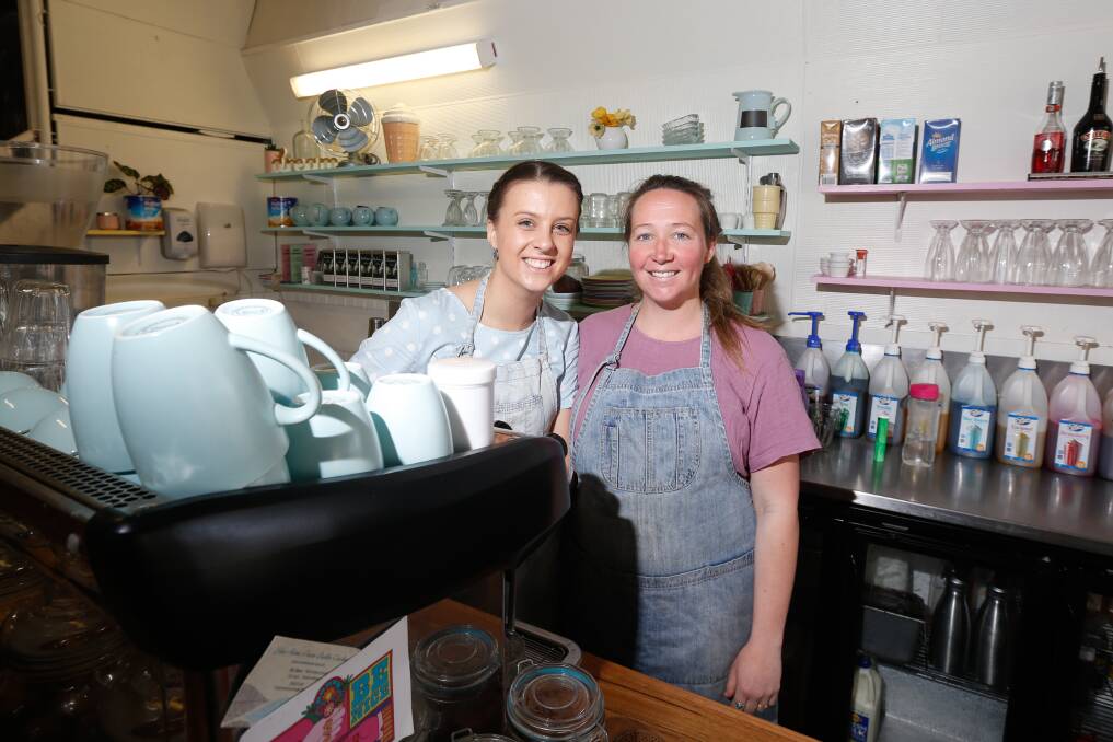 BITTERSWEET: Hunni's Cafe staff member Maddie Solly and Hunnah James will be sad to close the doors for the last time next week after four-and-a-half years. Picture: Mark Witte