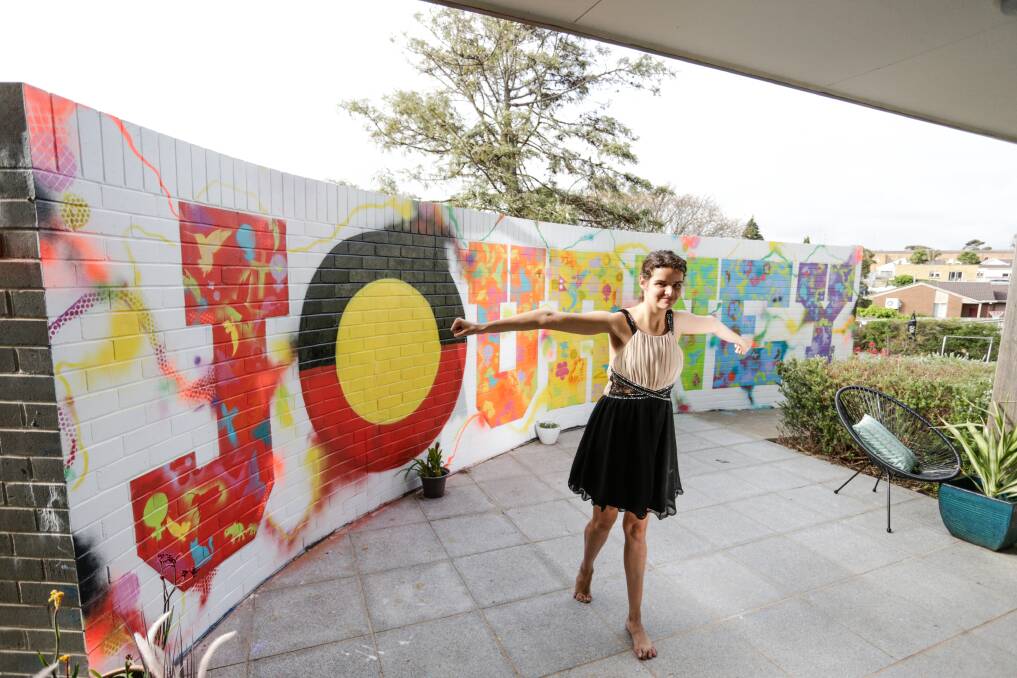 FINISHED: Jasmin Anton helped paint the mural during a three-month collaboration between residents and artists at The Foyer. Picture: Mark Witte