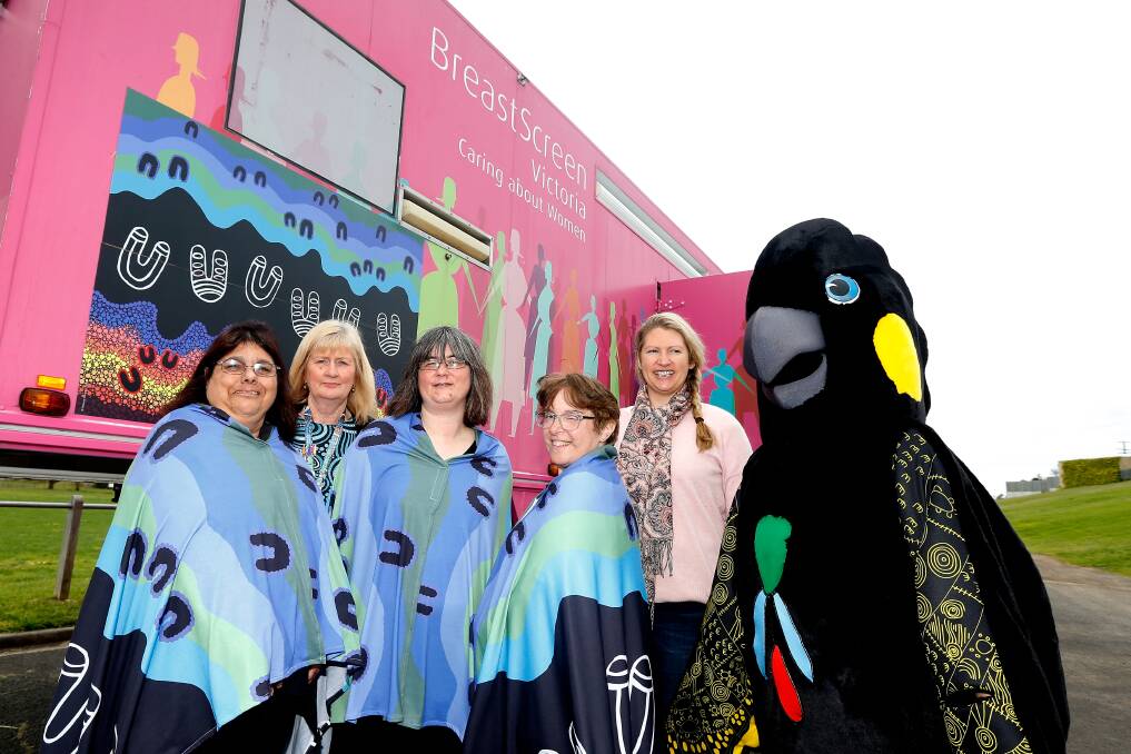 Cultural shawls: Gunditjmara women Beverley Harrison, Jenny Sack, Tanya Geier, Georgie Taylor, prevention and early intervention coordinator Rachael Gladman and Wilan the mascot at the pink van. Picture: Mark Witte
