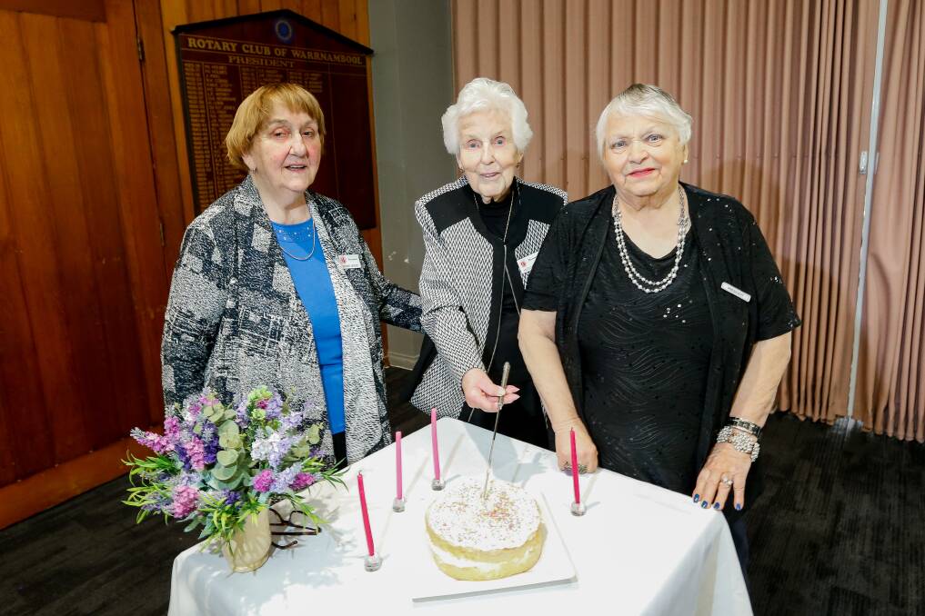 MARKING MILESTONE: Denise Moody, Margaret Wilson and Maxine Golding-Clarke cut the cake at the Probus Club of Warrnambool's 34th birthday. Picture: Anthony Brady