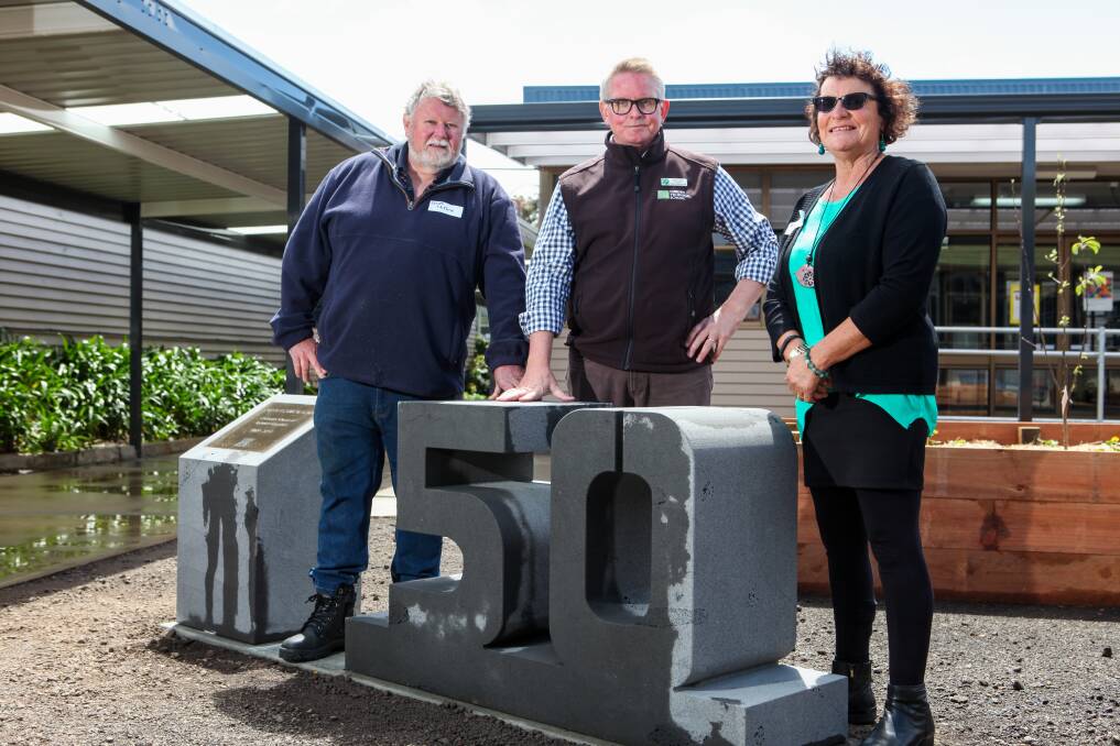 Unveiling: Cobden Technical School foundation students Geoff Clifford (1969) and Faye Searle nee Russell (1973) at the 50th anniversary monument with current principal Rohan Keert (centre). Picture: Rob Gunstone