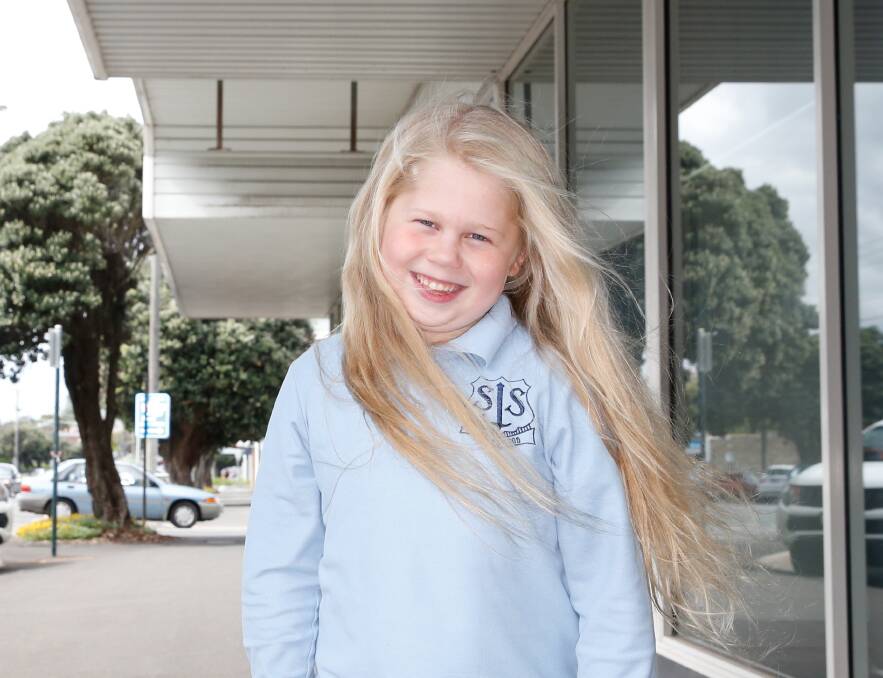 GIVING BACK: Seven-year-old Jess Happ will cut her hair short for cancer wigs in December and she hopes to raise $500 for the Cancer Council. Picture: Mark Witte