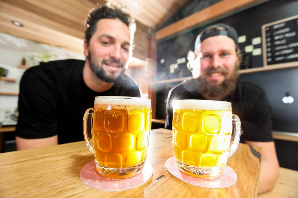 A FINE BREW: Sam Rudolph and Alex Carr with their pale ale. Picture: Rob Gunstone