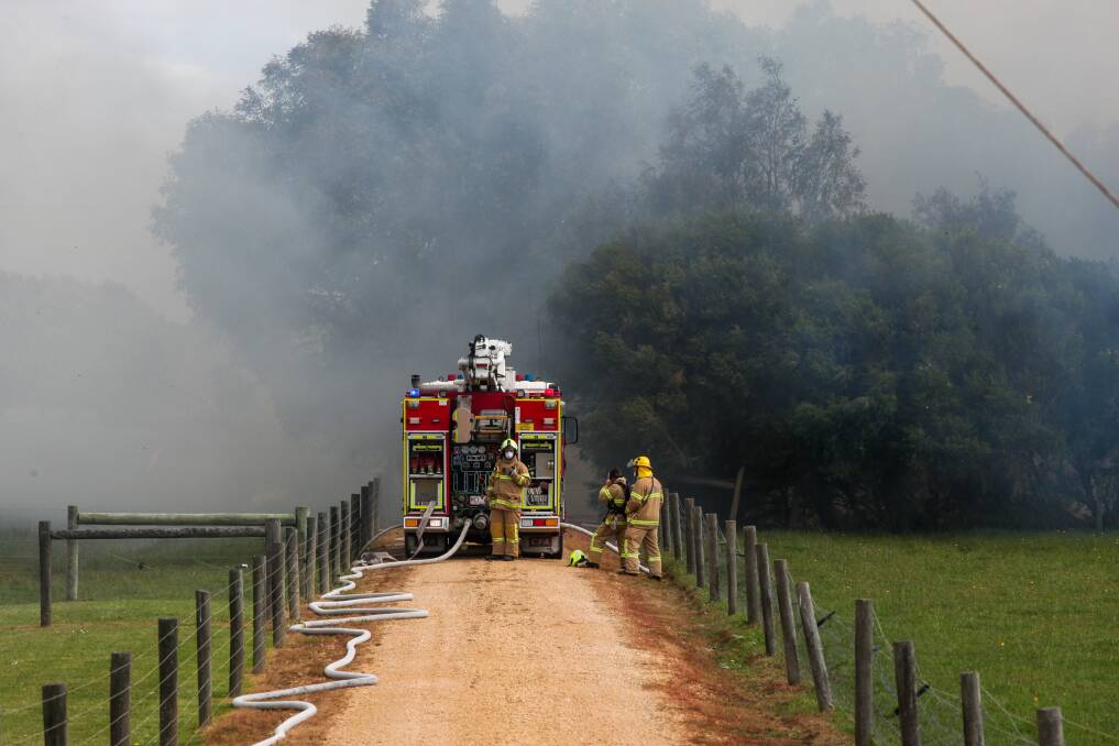 Battle: Firefighters battle to save a house in Cleary Road. Picture: Rob Gunstone