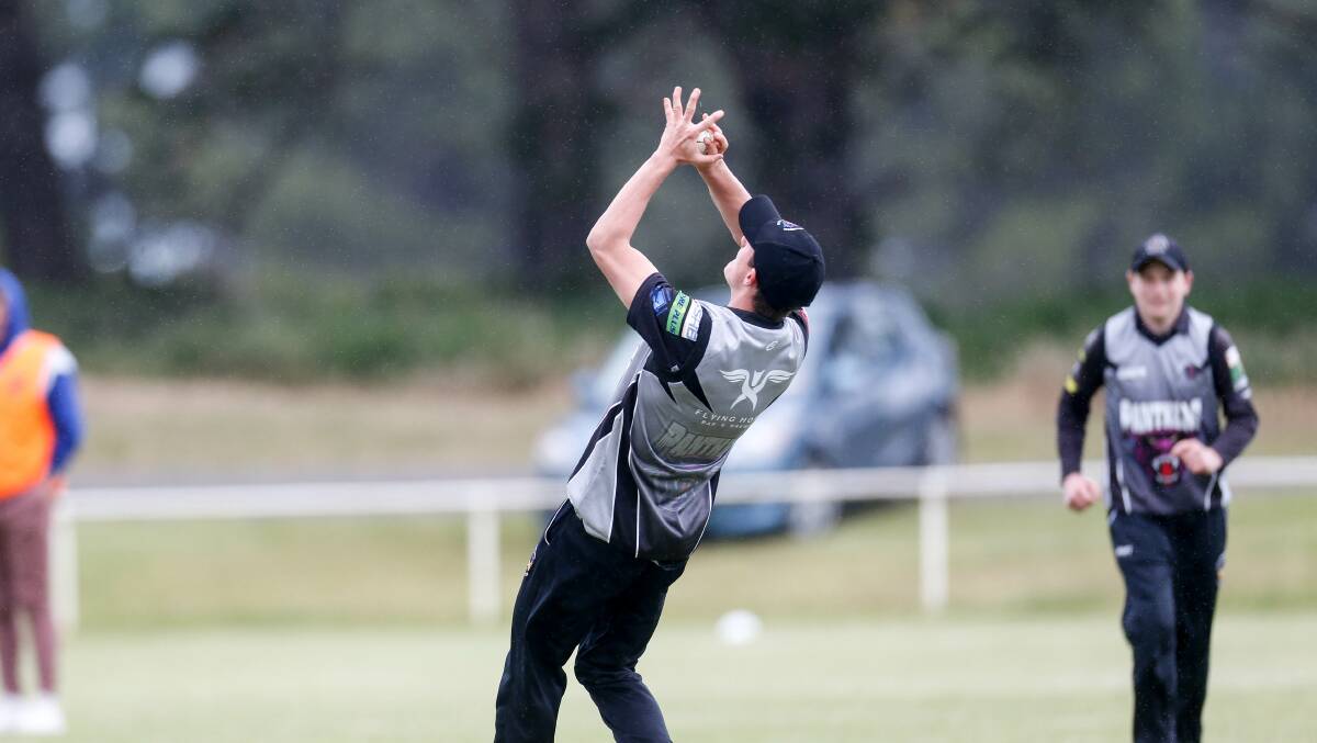 Important take: West Warrnambool's Fletcher Cozens catches Russells Creeks' Cameron Williams.