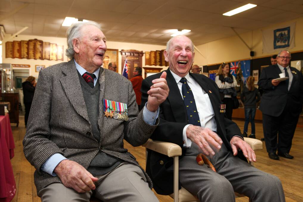 Penny for your thoughts: WWII veterans Lem Pomeroy and Sam Wiltshire share a joke at the opening of the Terang RSL tram project. Picture: Rob Gunstone