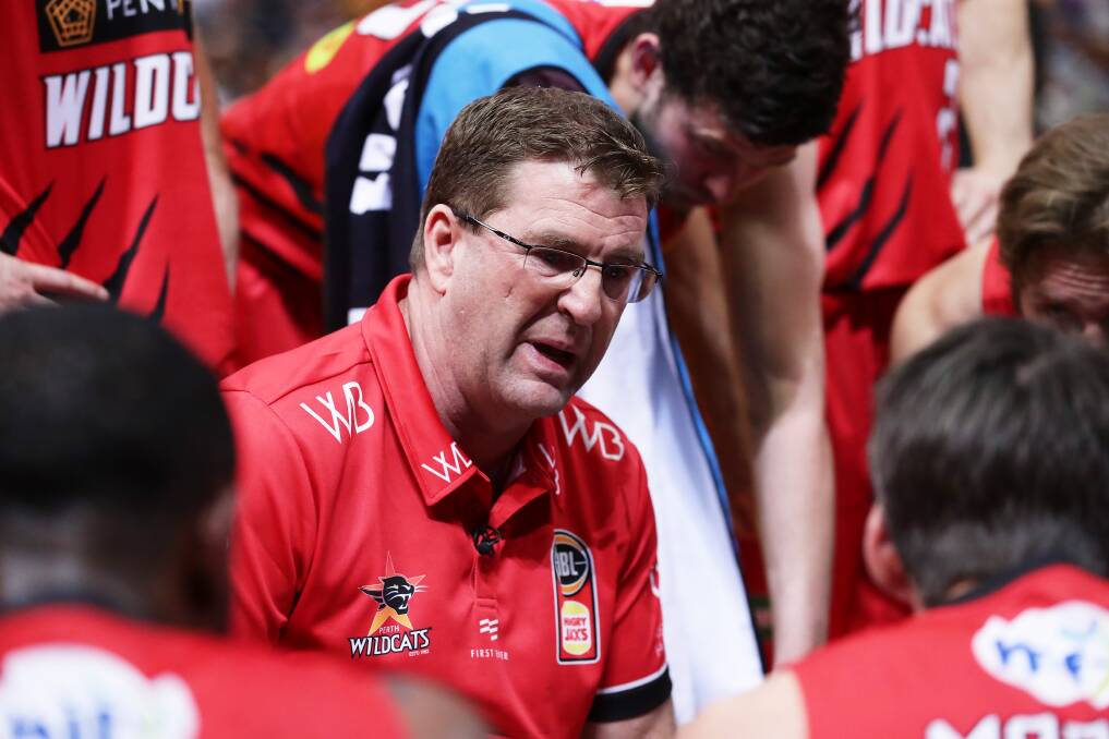 Wildcats head coach Trevor Gleeson speaks to his players during the round six NBL match between the Sydney Kings and the Perth Wildcats at Qudos Bank Arena on November 10 in Sydney.