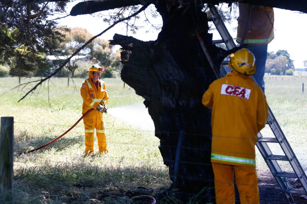 Under control: CFA members work to contain the escaped burn-off in Purnim. Picture: Mark Witte