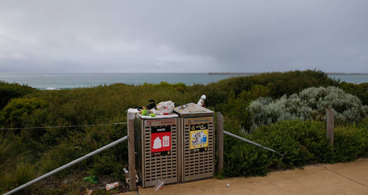 Not pretty: Rubbish spews out of a bin at Warrnambool's McGennan Car Park this week as council staff work bans hit. Picture: Mark Witte