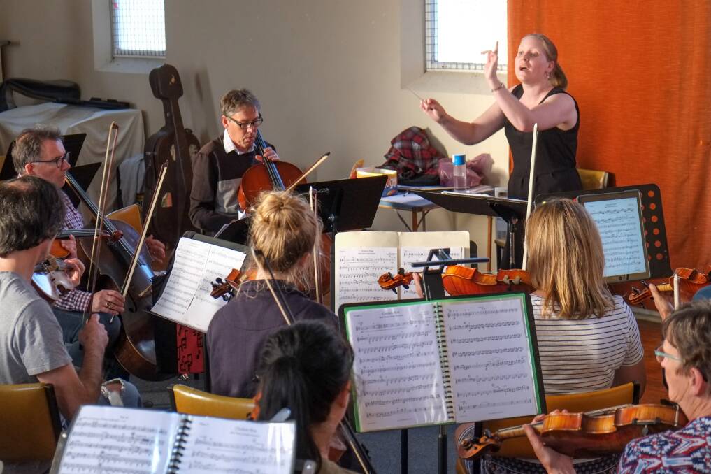 In tune: Conductor Sonia Beal puts Warrnambool Symphony Orchestra members through their paces ahead of the Peter and the Wolf Children's Concert on Sunday. Picture: Rob Gunstone
