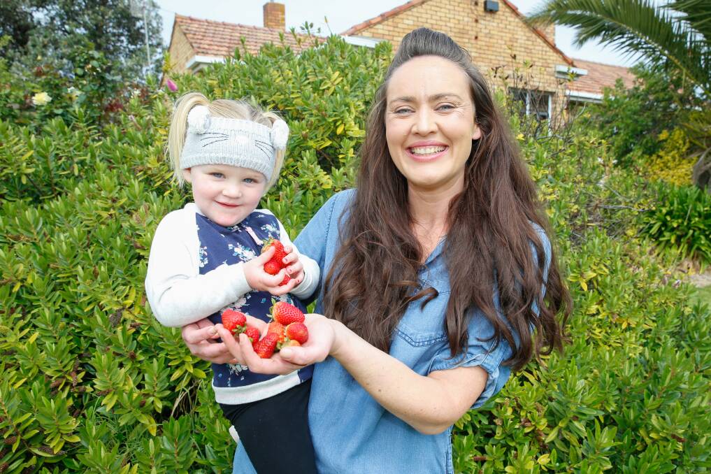 YUM: Port Fairy's Myra Murrihy and her daughter Laura, 2, are excited about the Anglican Strawberry Fete on Sunday. Picture: Mark Witte