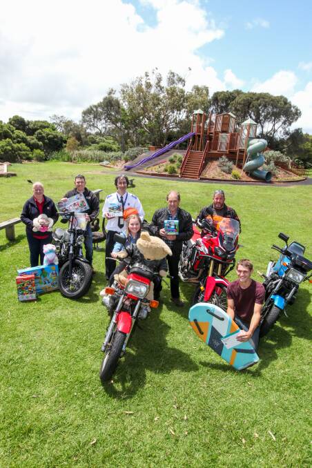Warrnambool Salvation Army's Sally Stephenson, motorbike rider Chris Warnecke, Salvation Army's Chris Philpot, Keira Warnecke, 11, Trevor Warnecke, Steve Hardy and Brad Warnecke all get ready for the annual Warrnambool Motorcycle Toy Run. Picture: Rob Gunstone