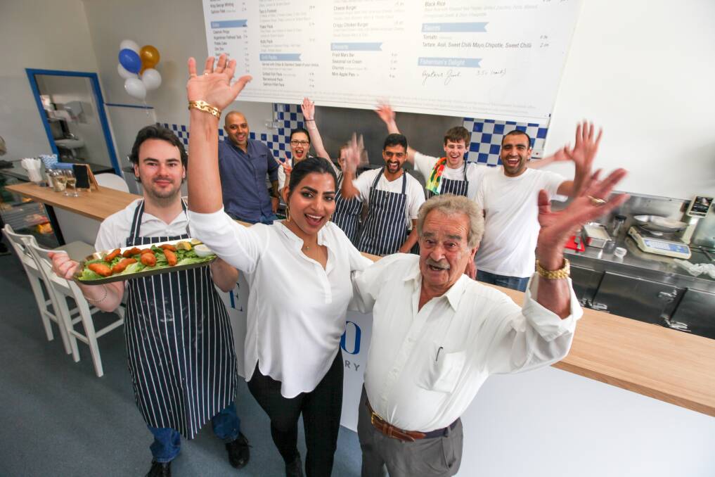 HOORAY: Jonathon Williams, Sophie Surbhi and George Politis celebrate the re-opening of Liebig Streets Seafood Fish and Chips. Picture: Rob GUnstone