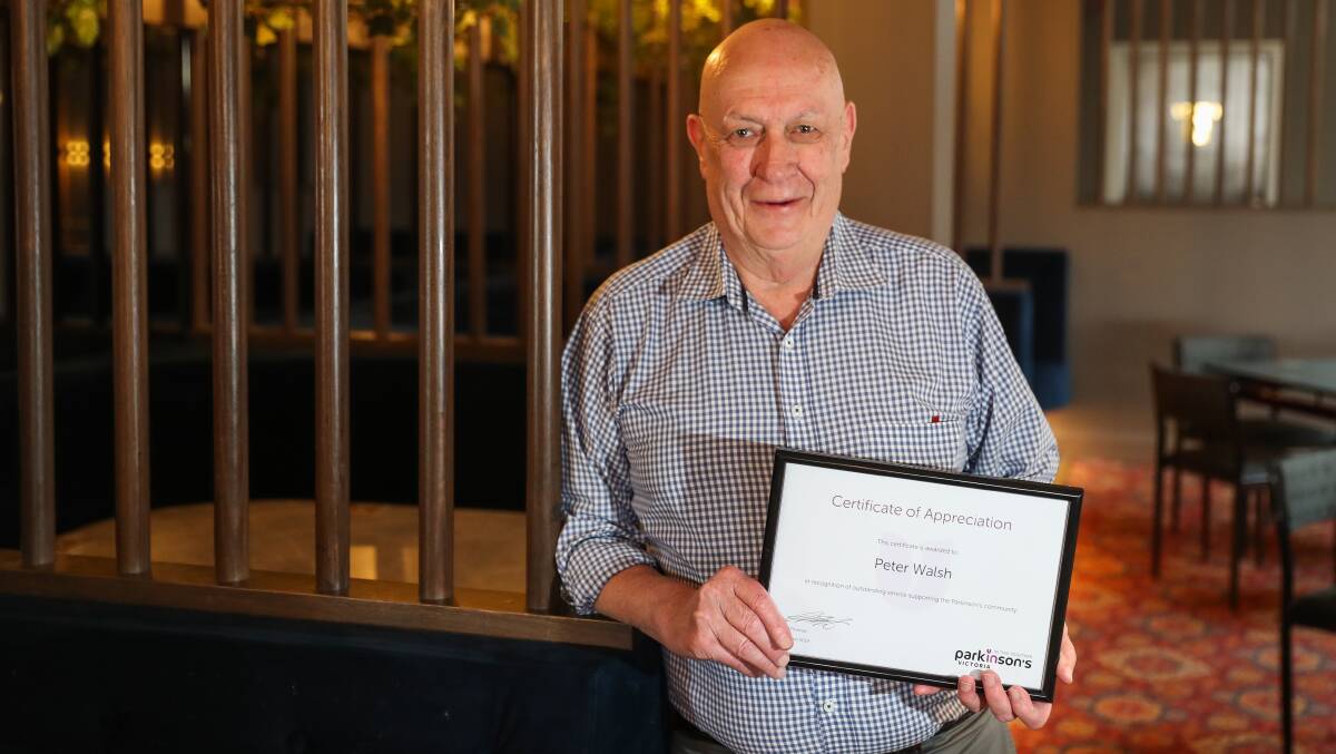 HUMBLED: Peter 'Cork' Walsh with his Certificate of Appreciaton from Parkinson's Victoria. Picture: Morgan Hancock