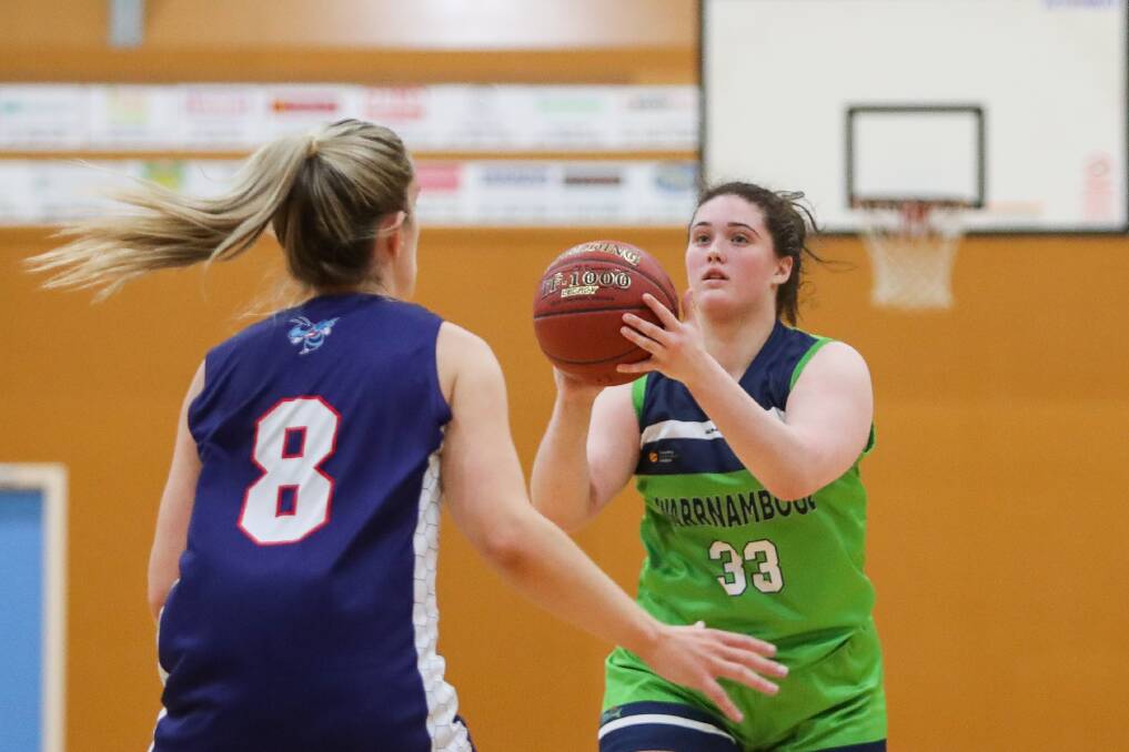 Back in action: Warrnambool Mermaids' Molly McKinnon looks up-court against the Horsham Lady Hornets on Saturday night. Picture: Morgan Hancock