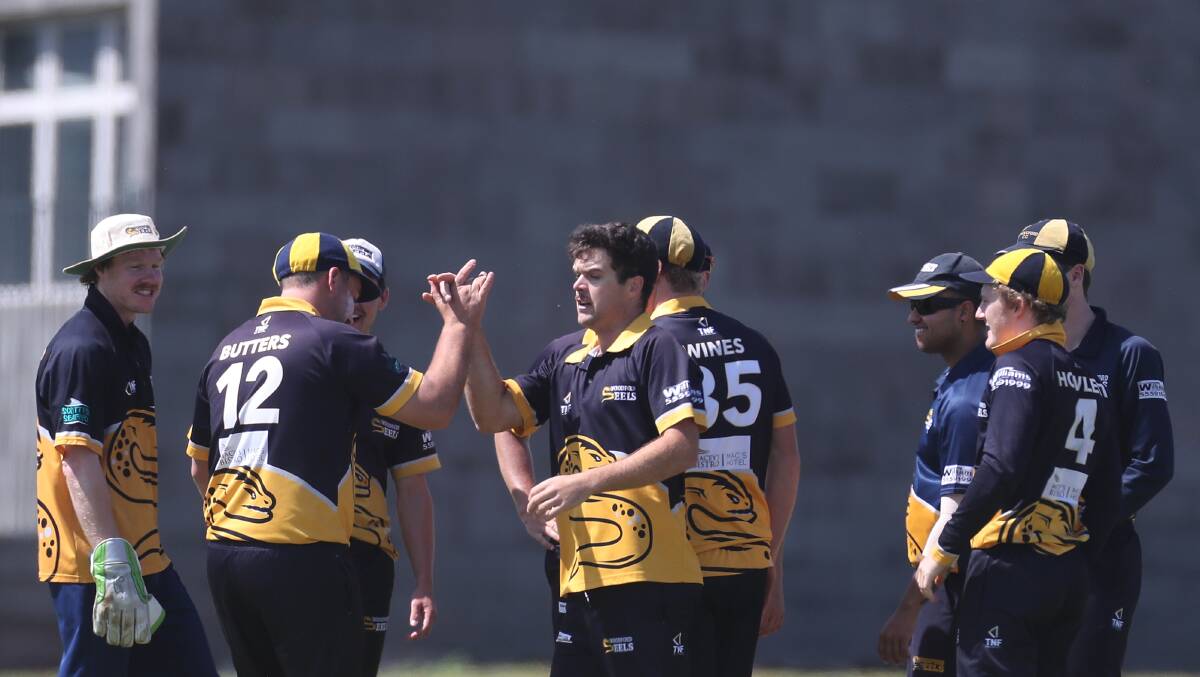 Woodford's Hank Schlaghecke and Nick Butters high five each other after a wicket. Picture: Mark Witte