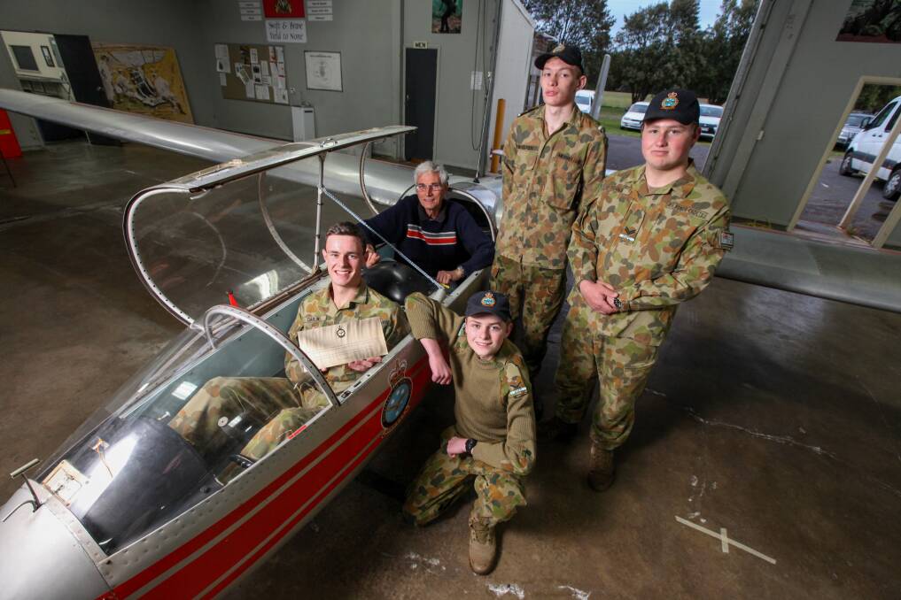 Restored: Cadet Taylor Carlin and glider expert Mike Coates, with cadet engineering crew Thomas McCosker, Matthew McQueen and Jack O'Toole.