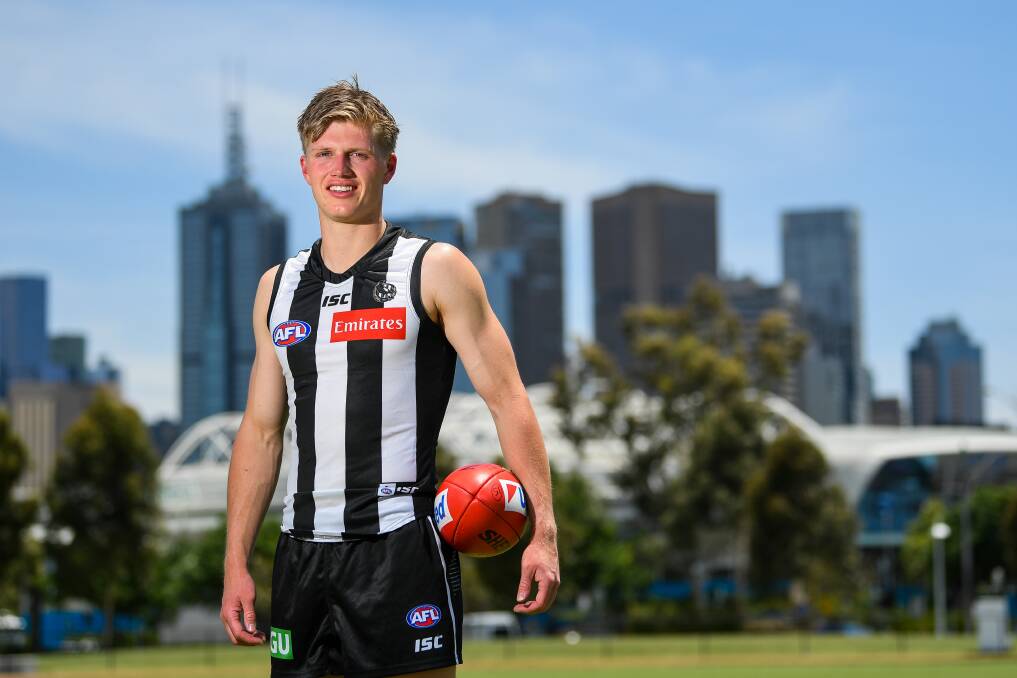 NEW HOME: South Warrnambool export Jay Rantall poses in front of the Melbourne Skyline in his Collingwood colours. Picture: Morgan Hancock
