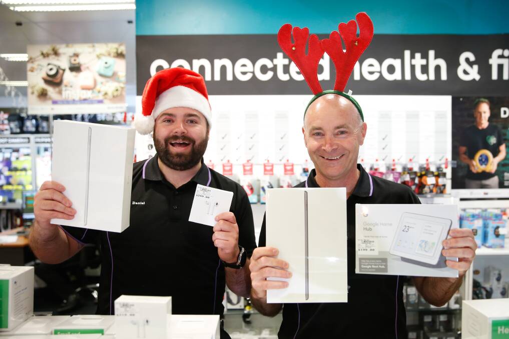 GADGETS: Harvey Norman computer manager and Steve Walker, right, and sales person Daniel Harding Harvey Norman with some of the most popular items selling this year ahead of Christmas. Picture Mark Witte