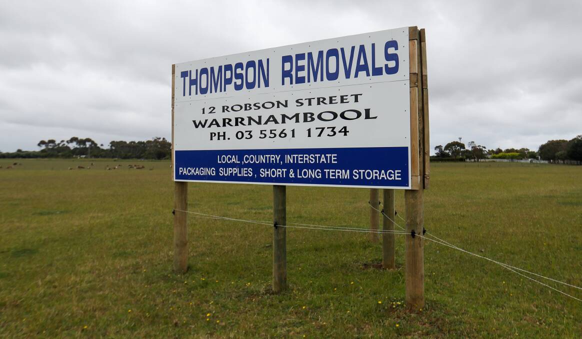 WCC has asked John Cozens to remove his Thompson Removals sign from his property.
