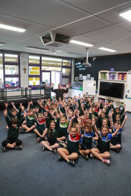 YAY: St Patrick's Primary School Koroit principal Mark Moloney and students celebrate the funding announcement. Picture: Morgan Hancock