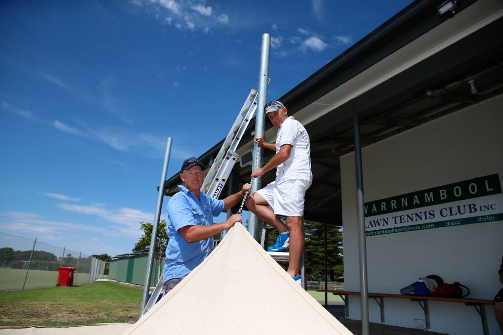 Busy: Warrnambool Lawn Tennis Club vice-president Shane Gedye and Tony Robinson are helping complete some upgrades at the club. Picture Mark Witte
