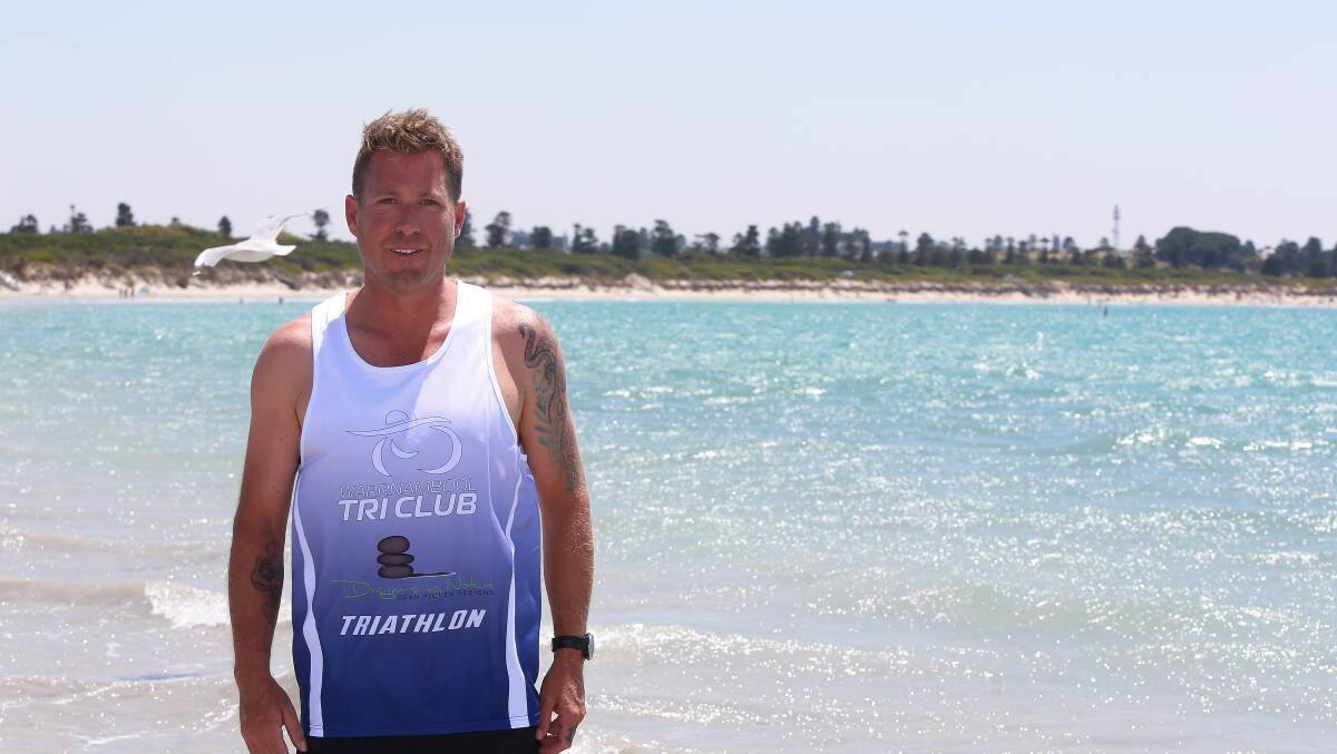 Summer: Warrnambool Tri Club member Mark Gavin at Warrnambool Beach. He's competing in the club's aquathon criterion on Friday evening. Picture: Mark Witte