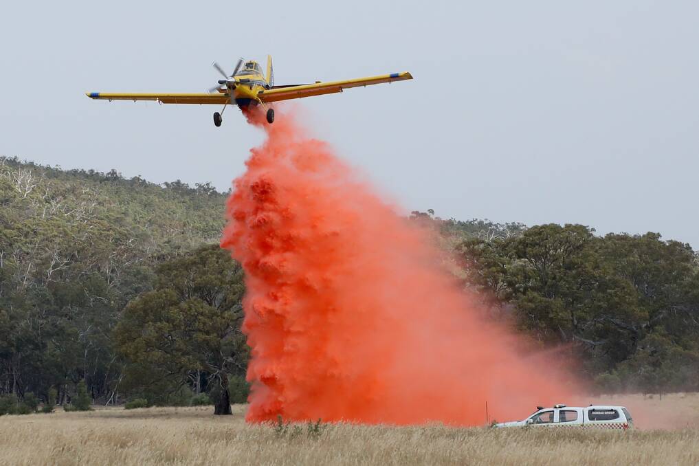 Fire: An aircraft drops fire retardant on the Dunkeld bushfire on Friday. Picture: Morgan Hancock