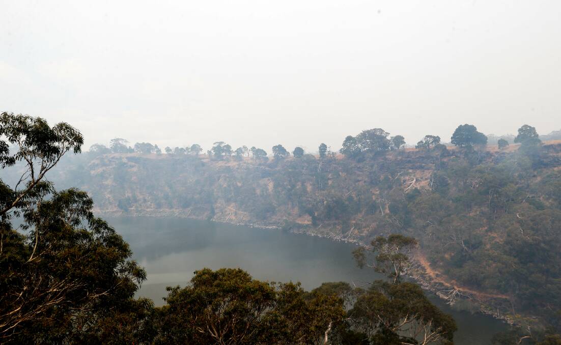 Smoke blankets the Lake Surprise crater at Budj Bim National Park. Picture: Anthony Brady