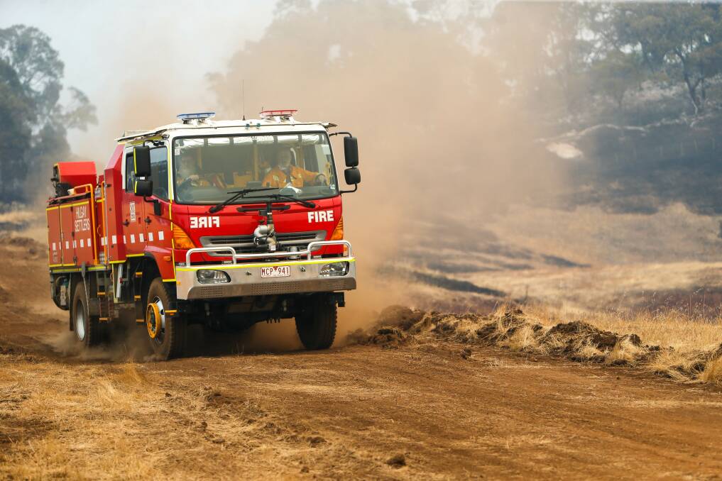 A firetruck on farmland near the fire at Budj Bim National Park. Picture: Anthony Brady